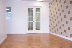 TILE AND WOOD FLOOR RECEPTION AREA. 5 OFFICES AND LARGE ROOM